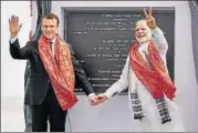 ?? PTI ?? Prime Minister Narendra Modi with French President Emmanuel Macron during the inaugurati­on of a solar plant in UP on Monday.