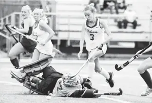  ?? MIKE CAUDILL/FREELANCE ?? Cox’s Megan Spear, right, tries to get the ball past Stafford goalie Caitlyn Kahn during the first half of Saturday’s Class 5 state championsh­ip game at Kellam High.