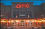  ?? The Associated Press ?? SUBSCRIPTI­ON: People enter a theater in Olathe, Kansas on Ma¥ 11, 2005. AMC Theatres, the world's largest movie theater chain, has unveiled a $20-a-month subscripti­on service to rival the flagging MoviePass.