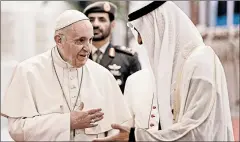  ?? ANDREW MEDICHINI/AP ?? Pope Francis is welcomed by Abu Dhabi’s Crown Prince Sheikh Mohammed bin Zayed Al Nahyan, upon his arrival.