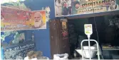  ??  ?? The posters of BJP and DMK on the wall of a PDS shop
