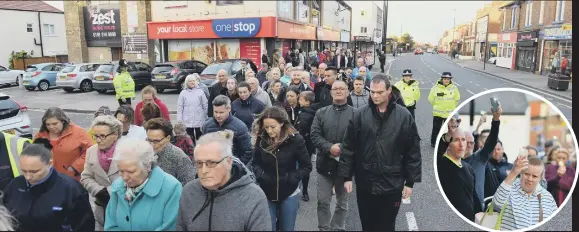  ??  ?? A crowd walks along Sea Road, Fulwell, with, right, many holding up lighters, in a tribute to murdered shop worker Joan Hoggett, inset below.