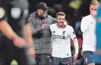  ??  ?? gracias, amigo Jurgen Klopp felicita a Adam Lallana luego del empate que marcó para los Reds.