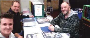  ??  ?? Enthusiast­s check out some of the offerings of stamp dealer Mike Lee (right) at the Warragul Philatelic Society’s recent stamp and coin fair.