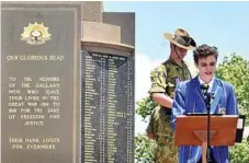  ??  ?? Toowoomba Grammar School senior student James White gives the address.