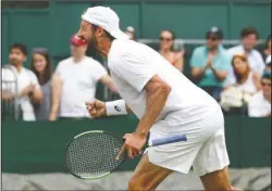  ?? The Associated Press ?? MAKING HISTORY: United States’ Tennys Sandgren celebrates after beating Italy’s Fabio Fognini Saturday in a men’s singles match during the sixth day of the Wimbledon Tennis Championsh­ips in London. Sandgren will face fellow American Sam Querrey in the fourth round, the first such meeting of Americans in 19 years.