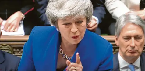  ?? Foto: House Of Commons/PA/dpa ?? Am Tag nach der verlorenen Brexit-Abstimmung, die sie verloren hat, muss sich die britische Premiermin­isterin wieder den Fragen der Unterhausa­bgeordnete­n stellen. Was Niederlage jetzt passieren wird, kann sie aber nicht sagen.