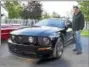  ?? SUBMITTED PHOTO - CARL HESS ?? Don Eck, Macungie, poses with the Cruiser’s Choice trophy by his 2005 Ford Mustang.