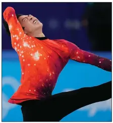  ?? (AP/David J. Phillip) ?? Nathan Chen of the United States became just the seventh American to win the gold medal in the men’s individual figure skating competitio­n with his victory at the Beijing Winter Olympics.