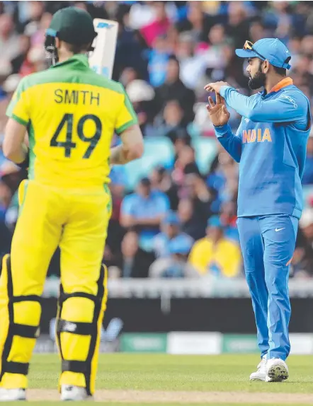  ?? Picture: AP PHOTO ?? India's captain Virat Kohli calls for a review against Steve Smith, but also supported the former Aussie skipper.