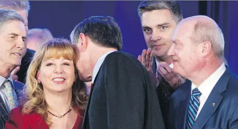  ?? GERRY KAHRMANN/FILES ?? Andrew Wilkinson, centre, has a word with of Dianne Watts after Wilkinson was elected leader at the B.C. Liberal party leadership convention in February. Wilkinson’s victory came despite being outspent by three other candidates, with Watts spending the...