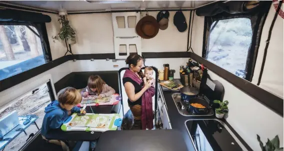  ??  ?? Bottom: The OEV Camper-X allows plenty of space for the twins to hang out
inside while Anna prepares a delicious
meal.