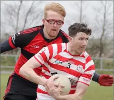  ??  ?? Pádraig Bolger (Ferns St. Aidan’s) is tackled by Jack Farragher.