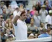  ?? KEVIN HAGEN — THE ASSOCIATED PRESS ?? Roger Federer, of Switzerlan­d, waves after defeating Benoit Paire, of France, during the second round of the U.S. Open tennis tournament, Thursday in New York.