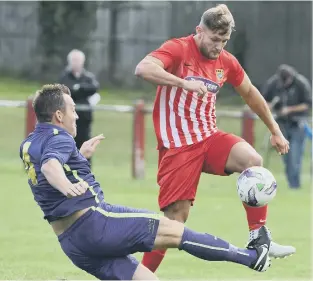  ??  ?? Ryhope CW (red and white) make their mark in last week’s impressive FA Vase win over Guisboroug­h. Pictures by Kevin Brady