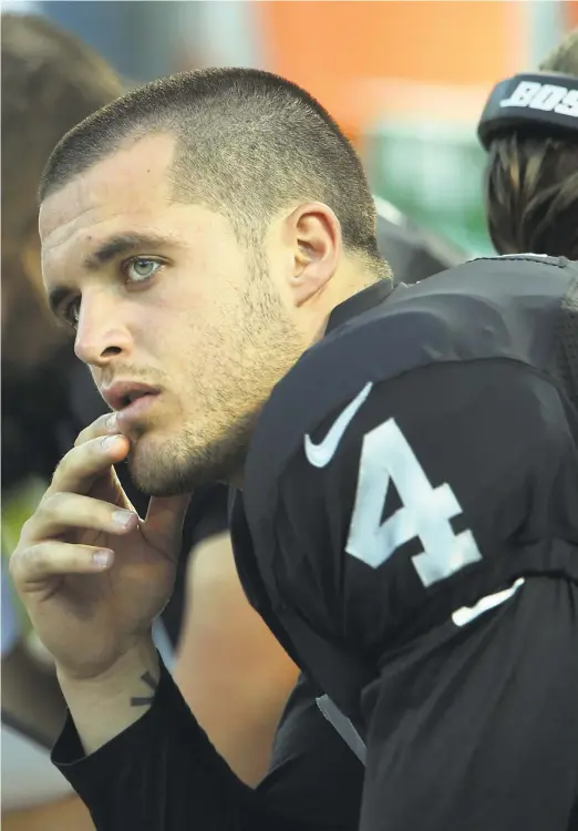  ??  ?? Quarterbac­k Derek Carr says he’s “always thinking of the next play, of the next call, of the next adjustment. I think he’s (Gruden) brainwashe­d me a little bit. I guess I kind of feel like his quarterbac­k robot a little bit.”