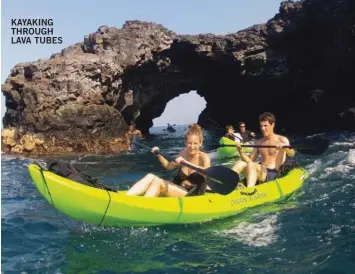  ??  ?? KAYAKING THROUGH LAVA TUBES