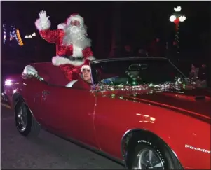  ?? The Sentinel-Record/File photo ?? PARADE CANCELED: Santa Claus waves to the crowd during the Hot Springs Christmas parade on Central Avenue on Dec. 5, 2017.