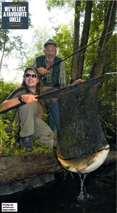  ??  ?? One big carp and two very happy anglers!