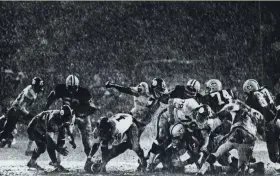  ??  ?? The Green Bay Packers and Pittsburgh Steelers battle it out in the rain at County Stadium on Aug. 31, 1968. The Packers beat the Steelers, 21-17, in the fifth exhibition game of the season under Green Bay’s new coach, Phil Bengston. Milwaukee Journal and Sentinel photograph­er Heinz Kluetmeier won second place for the photo, titled “American Gladiators,” in the sports category in the national Pictures of the Year competitio­n. The photo was published several times, including in the March 2, 1969, Milwaukee Journal.