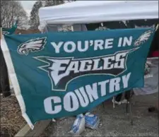  ?? PETE BANNAN — DIGITAL FIRST MEDIA ?? An Eagles flag flies from the pop-up tent on Wednesday.