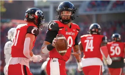  ?? Photograph: Icon Sportswire/ Getty Images ?? Cincinnati Bearcats quarterbac­k Desmond Ridder (9) reacts after scoring a touchdown earlier this season.