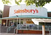  ?? Associated Press ?? ■ A branch of Sainsbury’s supermarke­t is seen June 17, 2009, in Selsdon, south London. It was reported Monday that Sainsbury’s has agreed to a merger deal with Walmart Inc.’s U.K. unit, Asda, for 7.3 billion pounds ($10.1 billion) in cash and stock in...