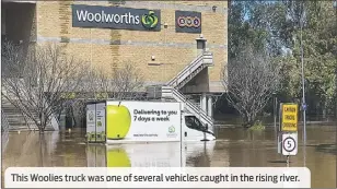  ?? ?? This Woolies truck was one ofseveral vehicles caught in the rising river.