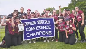 ?? Catherine Avalone / Hearst Connecticu­t Media ?? North Haven celebrates its 12-8 win over Amity in the SCC softball championsh­ip game Saturday at West Haven.