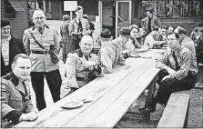  ?? [NEW YORK CITY MUNICIPAL ARCHIVES VIA AP] ?? Members of the German American Bund are shown at Camp Siegfried in Yaphank, N.Y., on May 22, 1938. Today, the residents of the few dozen homes built on the site are being forced to end policies that limited ownership to people of German descent.