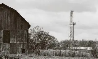  ?? Alex Brandon / Associated Press ?? A drilling rig is set up in 2011 near a barn in Springvill­e, Pa., to tap natural gas from the Marcellus Shale play. The region now has more fracking crews than Texas.