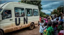  ?? LIAN QING / XINHUA ?? A new group of Chinese peacekeepe­rs wave goodbye last week to children in the SOS Children’s Village in Bukavu, Democratic Republic of Congo, after providing supplies and medical care. Chinese forces have offered assistance to the area for 12 years.