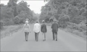  ??  ?? Guests taking an afternoon stroll through the Iwokrama Rainforest as the sun sets.