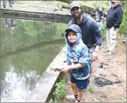  ?? Photo by Jake Mercer ?? Young anglers pulled in scores of trout Saturday afternoon at the Island Run Sportsmen's Club kids fishing derby.