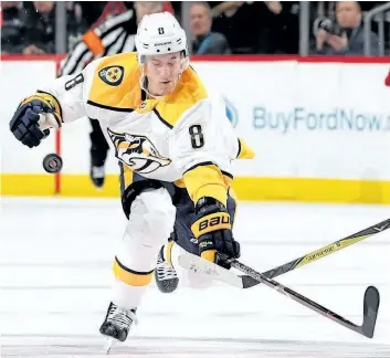  ?? GETTY FILES ?? Nashville Predators forward Kyle Turris lunges for the puck in a Jan. 25 game against the New Jersey Devils. Turris has watched with disbelief as his former team, the Ottawa Senators, have stumbled their way to the bottom of the standings.