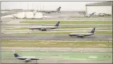  ?? GARY REYES — STAFF PHOTOGRAPH­ER ?? Airplanes wait on runways at San Francisco Internatio­nal Airport.