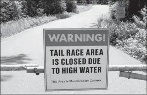  ?? The Sentinel-Record/RICHARD RASMUSSEN ?? A recreation­al fishing area below Remmel Dam in Hot Spring County is closed Friday because of flooding.