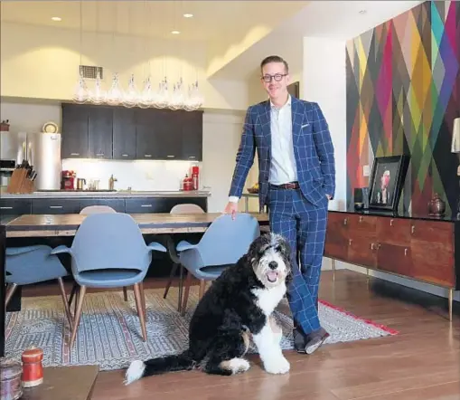  ?? Katie Falkenberg Los Angeles Times ?? CHRISTOPHE­R KOELSCH, here with Franklin, says his open-plan living area is “a central gathering spot, a convivial space.”