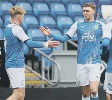  ?? ?? Joe Taylor (left) congratula­tes Jack Taylor on his goal against Charlton.