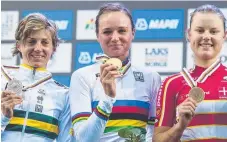 ??  ?? Gold Coast’s Katrin Garfoot (left) with her world road race silver medal next to Chantal Blaak (centre) and Amalie Dideriksen.