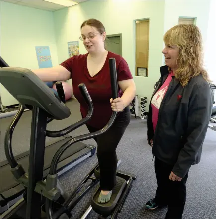  ?? CITIZEN FILE PHOTO ?? Margaret Tayti, left, gets help from Shannon Johnson from the Northern B.C. YMCA in the exercise room at the Activity Centre for Empowermen­t on Sixth Avenue in this 2015 file photo.