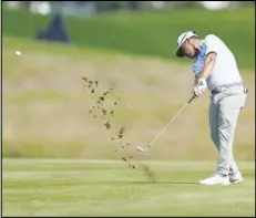  ?? Associated Press ?? J.J. Spaun hits from the second fairway during the second round of the St. Jude Championsh­ip golf tournament, Friday, in Memphis, Tenn. Spaun leads by one shot after two rounds.