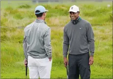  ?? JEFF CHIU/AP PHOTO ?? Tiger Woods, right, smiles while talking to Billy Horschel during practice on Tuesday for the PGA Championsh­ip at TPC Harding Park in San Francisco.