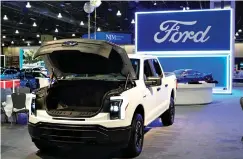  ?? (AP Photo/matt Rourke, File) ?? The Ford F-150 Lightning is displayed at the Philadelph­ia Auto Show on Jan. 27 in Philadelph­ia. Ford Motor Co. says it has suspended production and halted shipments of the F-150 Lightning electric pickup after a battery caught fire during a pre-delivery quality check. On Wednesday, the automaker said in a statement it has no reason to believe electric pickups already in use by customers are affected by the battery issue.