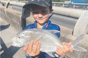  ?? ?? Reid Bevege had a great day landing this trevally fishing at Tweed Heads.