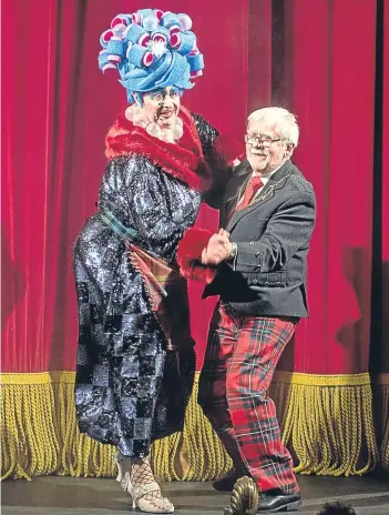  ?? Picture: Angus Findlay. ?? Perth Provost Dennis Melloy dances with Widow Twankey, actor Barrie Hunter, after the official opening.