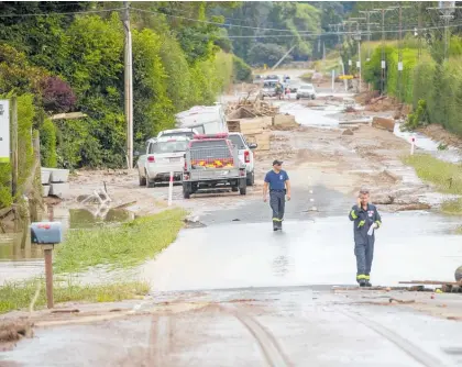  ?? Photo / Mark Mitchell ?? Hastings district was the hardest hit of any council area in Hawke’s Bay by the cyclone. Pictured is a road near Puketapu in the aftermath.