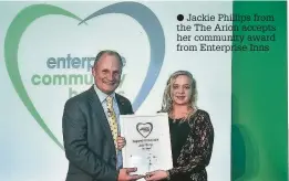  ??  ?? Jackie Phillips from the The Arion accepts her community award from Enterprise Inns