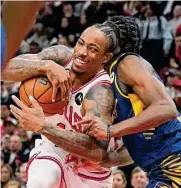 ?? Charles Rex Arbogast/associated Press ?? Chicago’s Demar Derozan, left, needs seven points to reach 20,000 for his career.