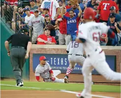  ?? AP Photo/Michael Ainsworth ?? Boston Red Sox right fielder Mookie Betts (50) makes a catch in foul territory off a hit by Texas Rangers catcher Robinson Chirinos (61) to end the second inning Tuesday in Arlington, Texas.